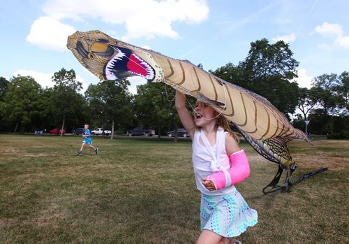 RUTH BONNEVILLE / WINNIPEG FREE PRESS 

Alaina McLaren runs with a large dinosaur kite on a windy Friday afternoon while playing with her brothers and friend.

Standup photo
Aug 24, 2017
