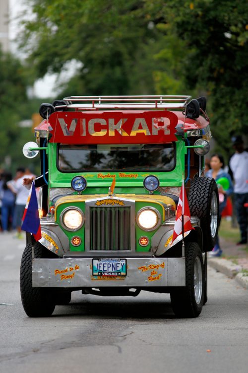 JUSTIN SAMANSKI-LANGILLE / WINNIPEG FREE PRESS
A 'jeepney' vehicle common in the Philippines participates in Saturday's Filipino Street Festival parade.
170826 - Saturday, August 26, 2017.