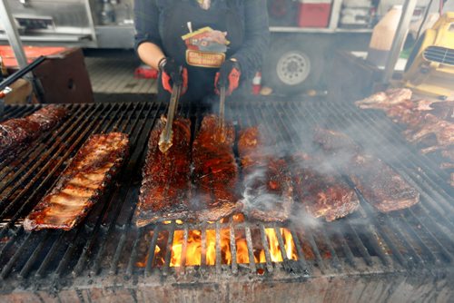 JUSTIN SAMANSKI-LANGILLE / WINNIPEG FREE PRESS
Freddy Kefalidis grills some ribs Saturday during Winnipeg Ribfest at The Forks.
170826 - Saturday, August 26, 2017.