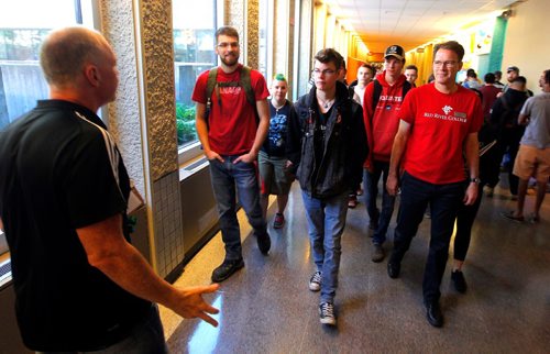 BORIS MINKEVICH / WINNIPEG FREE PRESS
Red River College first day for students today. Red River College President and CEO Paul Vogt, right wearing a red t-shirt, joins the first year Cabinetry and Woodworking Technology students on their tour of the college by instructor Frank Jess, left. August 28, 2017