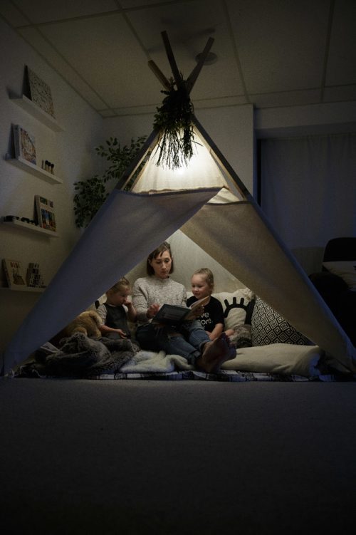 MIKE DEAL / WINNIPEG FREE PRESS
Jennifer Robins owner of the homebased Kate & Norah Co. sit's in a lavvu (that's pronounced la-VOO) with her children, Kate and Norah. The lavvu is a Scandinavian-style tent and were originally used by deer herders in the high Arctic. Hers are geared more towards children and are generally used as play areas at home, in the backyard or on the beach. 
170828 - Monday, August 28, 2017.