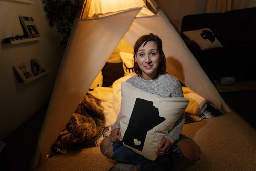 MIKE DEAL / WINNIPEG FREE PRESS
Jennifer Robins owner of the homebased Kate & Norah Co. sit's beside a lavvu (that's pronounced la-VOO). The lavvu is a Scandinavian-style tent and were originally used by deer herders in the high Arctic. Hers are geared more towards children and are generally used as play areas at home, in the backyard or on the beach. 
170828 - Monday, August 28, 2017.