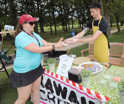 JASON HALSTEAD / WINNIPEG FREE PRESS

L-R: Kelly Kalynuk (Winnipeg Harvest volunteer services staffer) gets a crepe from Shane Cameron of Kawaii Crepe, one of the event sponsors at the Winnipeg Harvest Charity Golf Tournament at St. Boniface Golf Club on Aug. 28, 2017. (See Social Page)