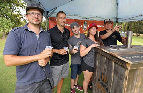 JASON HALSTEAD / WINNIPEG FREE PRESS

L-R: Golfers Jason Hachkowski and Jos Vervaet enjoy beer and candied bacon at the Brazen Hall tent with staff members Andrew Labao, Kailey Forsyth and brewer Jeremy Wells during the Winnipeg Harvest Charity Golf Tournament at St. Boniface Golf Club on Aug. 28, 2017. (See Social Page)