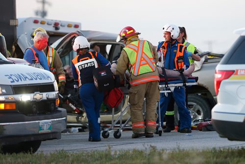 JOHN WOODS / WINNIPEG FREE PRESS
Emergency crews and STARS work to extricate the driver in an MVC at the intersection of highway 1 and 248 at Elie Monday, August 28, 2017.