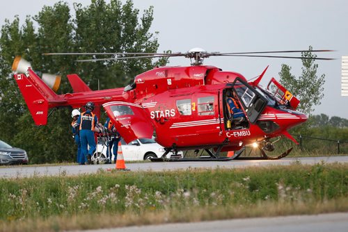 JOHN WOODS / WINNIPEG FREE PRESS
Emergency crews and STARS work to extricate the driver in an MVC at the intersection of highway 1 and 248 at Elie Monday, August 28, 2017.