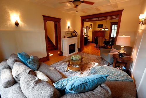 JUSTIN SAMANSKI-LANGILLE / WINNIPEG FREE PRESS
The living-room of 134 Scotia features a fireplace and a large window looking over the front yard. 
170829 - Tuesday, August 29, 2017.
