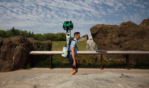 MIKE DEAL / WINNIPEG FREE PRESS
Cody Chomiak, Director of Marketing at Tourism Winnipeg, walks a backpack version of the Google Street View camera through the Assiniboine Park Zoo Tuesday afternoon. Tourism Winnipeg has partnered with Google to capture a number of attractions in Winnipeg. The backpack contains 15 separate cameras and can collect 360-degree panoramic imagery. It can be taken places the Street View vehicles can't go. Over the next six weeks the organization will be at the Assiniboine Park and Zoo, FortWhyte Alive, The Forks and Fort Gibraltar. 
170829 - Tuesday, August 29, 2017.