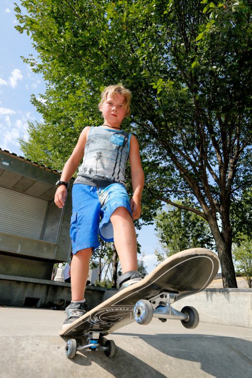 JUSTIN SAMANSKI-LANGILLE / WINNIPEG FREE PRESS
Ryland Orvis, 8, poses with his skateboard Tuesday afternoon at The Forks skatepark.
170829 - Tuesday, August 29, 2017.