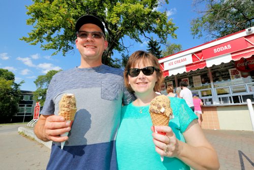 JUSTIN SAMANSKI-LANGILLE / WINNIPEG FREE PRESS
Glenn and Stacy Schulz cool down with some BDI soft serve Tuesday afternoon.
170829 - Tuesday, August 29, 2017.