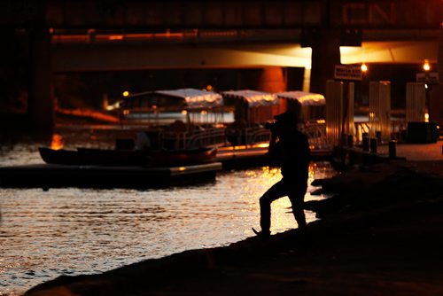 JOHN WOODS / WINNIPEG FREE PRESS
A participant in a From Here and Away nighttime photo excursion as part of Summertide at The Forks in Winnipeg Tuesday, August 22, 2017.