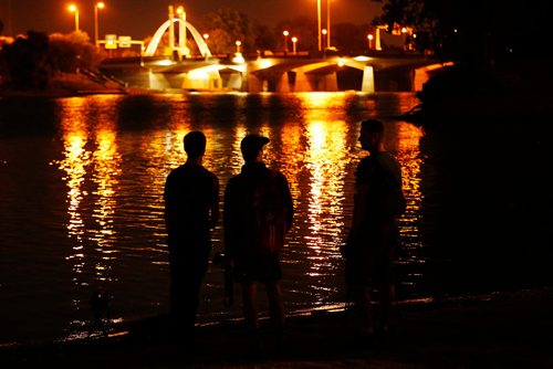 JOHN WOODS / WINNIPEG FREE PRESS
Participants photograph the Norwood Bridge in a From Here and Away nighttime photo excursion as part of Summertide at The Forks in Winnipeg Tuesday, August 22, 2017.