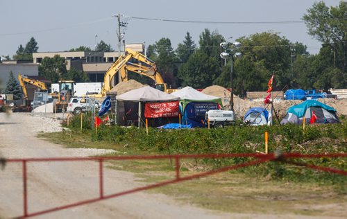 MIKE DEAL / WINNIPEG FREE PRESS
Construction continues around protesters who have been camped out on the Parker lands development site since July 14.
170830 - Wednesday, August 30, 2017.