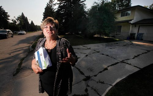 PHIL HOSSACK / WINNIPEG FREE PRESS  -  City Counsilor Janice Lukes stands in front of a Thatcher Drive house used as an illegal rooming house Wednesday evening. She's holding a report to be released Thursday on the issue.  See story - August 30, 2017