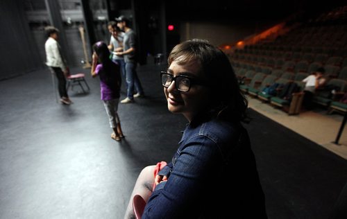 PHIL HOSSACK / WINNIPEG FREE PRESS  -  Alice in the Land of Wonders producer Shaden Abusaleh poses in the wings while actors rehears the play behind her. See Carol Sanders story - August 30, 2017