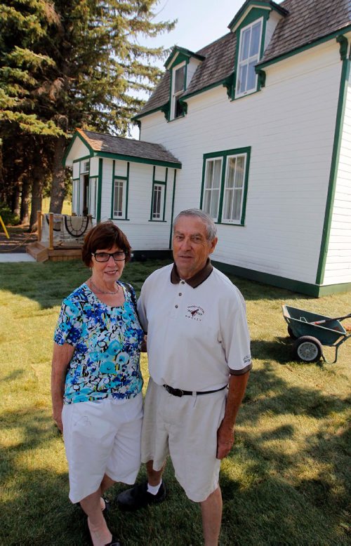 BORIS MINKEVICH / WINNIPEG FREE PRESS
Manitou, MB - Nellie McClung buildings and exhibit. The buildings have been repaired and moved back to Manitou, MB. The town has made a special place for them with new sidewalks to access the buildings. From left, Bette Mueller and her husband Walter pose in front of the old house that was moved to the site. BILL REDEKOP STORY. August 30, 2017