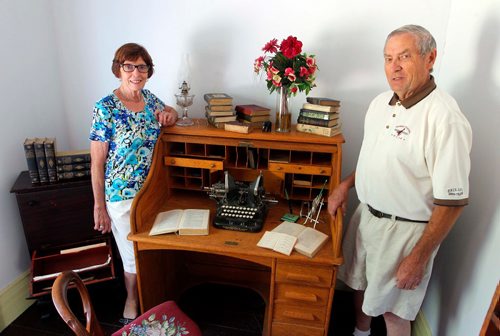 BORIS MINKEVICH / WINNIPEG FREE PRESS
Manitou, MB - Nellie McClung buildings and exhibit. The buildings have been repaired and moved back to Manitou, MB. The town has made a special place for them with new sidewalks to access the buildings. From left, Bette Mueller and her husband Walter pose in the room that McClung used to write in. BILL REDEKOP STORY. August 30, 2017