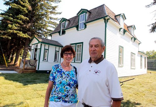BORIS MINKEVICH / WINNIPEG FREE PRESS
Manitou, MB - Nellie McClung buildings and exhibit. The buildings have been repaired and moved back to Manitou, MB. The town has made a special place for them with new sidewalks to access the buildings. From left, Bette Mueller and her husband Walter pose in front of the old house that was moved to the site. BILL REDEKOP STORY. August 30, 2017