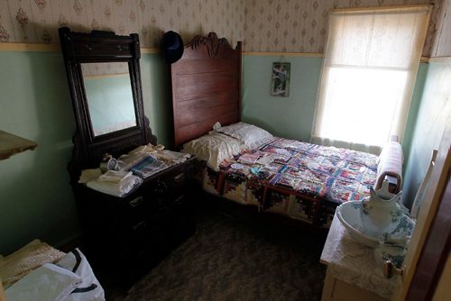BORIS MINKEVICH / WINNIPEG FREE PRESS
Manitou, MB - Nellie McClung buildings and exhibit. The buildings have been repaired and moved back to Manitou, MB. The town has made a special place for them with new sidewalks to access the buildings. This is the bedroom of the building where McClung boarded at. (The yellow building). BILL REDEKOP STORY. August 30, 2017