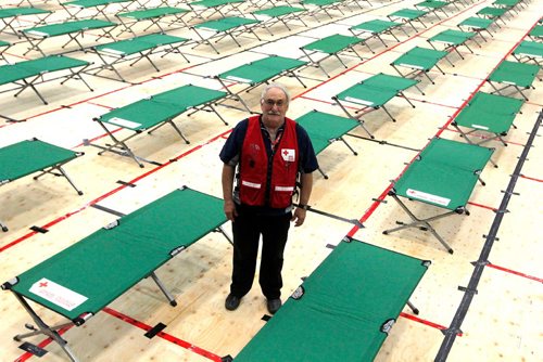 BORIS MINKEVICH / WINNIPEG FREE PRESS
Winnipeg, MB - This is a portrait of volunteer and site manager Bob Chochinov. Red Cross workers set up cots for fire evacuees this morning in the Winnipeg Soccer North indoor complex. They covered the artificial turf with thousands of sheets of plywood. BEN WALDMAN STORY. Sept. 1, 2017