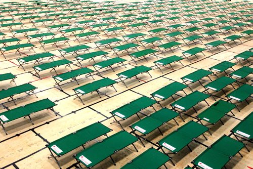 BORIS MINKEVICH / WINNIPEG FREE PRESS
Winnipeg, MB - Red Cross workers set up cots for fire evacuees this morning in the Winnipeg Soccer North indoor complex. They covered the artificial turf with thousands of sheets of plywood. BEN WALDMAN STORY. Sept. 1, 2017