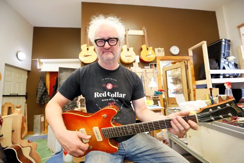 JUSTIN SAMANSKI-LANGILLE / WINNIPEG FREE PRESS
Al Beardsell poses with an electric guitar he made around 1996 that has found its way back into his workshop for some repairs.
170901 - Friday, September 01, 2017.