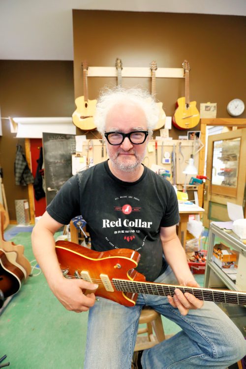 JUSTIN SAMANSKI-LANGILLE / WINNIPEG FREE PRESS
Al Beardsell poses with an electric guitar he made around 1996 that has found its way back into his workshop for some repairs.
170901 - Friday, September 01, 2017.