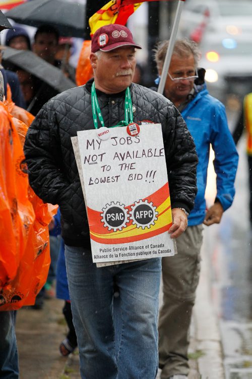 JOHN WOODS / WINNIPEG FREE PRESS
About two hundred came together to march down Broadway to Vimy Park in the Labour Day March Monday, September 4, 2017.