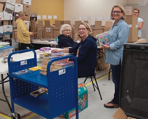 Canstar Community News Volunteers work seven days a week throughout the year sorting and pricing donated books for the annual Children's Hospital Book Sale. (SHELDON BIRNIE/CANSTAR/THE HERALD)