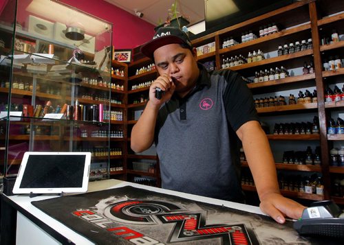 BORIS MINKEVICH / WINNIPEG FREE PRESS
The Province of Manitoba is banning the sale of vape to minors, use indoors and in public settings. Photo taken of Flamingo vape shop manager Mike C showing what vaping is in the store on north Main Street. Sept. 6, 2017