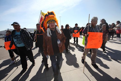 RUTH BONNEVILLE / WINNIPEG FREE PRESS 

Garden Hill first nation chief Dino Flett (centre) heads up a protest walk from soccer complex at 770 Lela where his community is being housed  to the Manitoba legislative building Thursday. He is  asking the provincial government to help house the  574 people from his community living at the soccer complex as well as hundreds more staying at RBC convention centre to be put up in hotels so they are not sleeping on cots. He's also asking the government to help put out the fires in their community so they can go home as soon as possible.

SEPT 07, 2017
