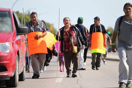 RUTH BONNEVILLE / WINNIPEG FREE PRESS 

Garden Hill First Nation members and elders walk down Leila Ave from Winnipeg Soccer North indoor complex in protest to members of their community being housed at  soccer complex at 770 Lela  and head to  the Manitoba legislative building Thursday. The Chief and community are  asking the provincial government to help house the  574 people from his community living at the soccer complex as well as hundreds more staying at RBC convention centre to be put up in hotels so they are not sleeping on cots. He's also asking the government to help put out the fires in their community so they can go home as soon as possible.

SEPT 07, 2017
