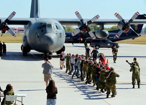 BORIS MINKEVICH / WINNIPEG FREE PRESS
Canadian Armed Forces (CAF) members and Department of National Defence (DND) employees attempt to pull a 41-ton Hercules aircraft in a competition kicking off 17 Wing Winnipegs annual Government of Canada Workplace Charitable Campaign (GCWCC). The winning teams will represent the Canadian Armed Forces at the annual United Way of Winnipeg Plane Pull to take place a week later. The winner for the Herc Pull was 17 MSS (Mission Support Squadron) at 12.87 seconds. Sept. 8, 2017