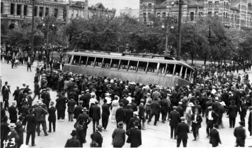 1919 Winnipeg general strike street car streetcar overturned on Main Street in front of the old City Hall building (R)