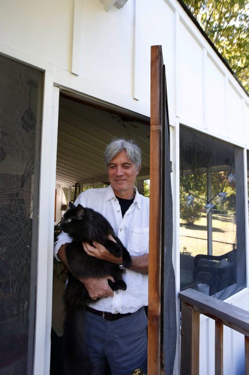 WAYNE GLOWACKI / WINNIPEG FREE PRESS
49.8 Cordell Barker, Academy Award-nominated animators 1988 film The Cat Came Back has just come out in book form. Here is Cordell in his back yard screened in porch with his cat Murphy. Dave Sanderson story Sept. 8 2017