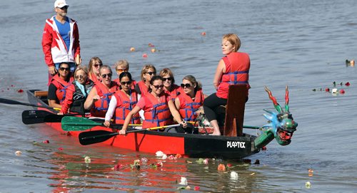JASON HALSTEAD / WINNIPEG FREE PRESS

Members of the Tyndall Park Twisters team take part in the flower ceremony at the Canadian Cancer Society September Dragon Boat Challenge on Sept. 9, 2017 at the Manitoba Canoe & Kayak Centre. The flower ceremony involves flowers being placed in the water to honour those living with or taken by cancer. (See Social Page)