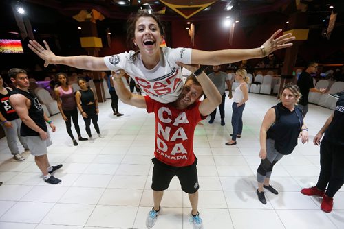 JOHN WOODS / WINNIPEG FREE PRESS
Nick Berburg and Hailey Musto, who have been on the national cheerleading squad, show a group of students some moves at the Winnipeg International Salsa Festival Sunday, Sept 10, 2017.