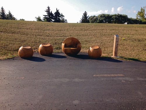 Canstar Community News This custom-built seat, called Scattered Spheres, was fashioned from solid Winnipeg urban elm.