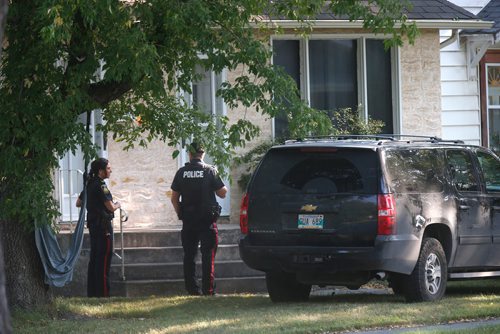 WAYNE GLOWACKI / WINNIPEG FREE PRESS

Winnipeg Police on McAdam ave. near Akins St. Tuesday morning watch a house three doors down regarding a serious incident earlier.  Kevin Rollason story   Sept. 12 2017