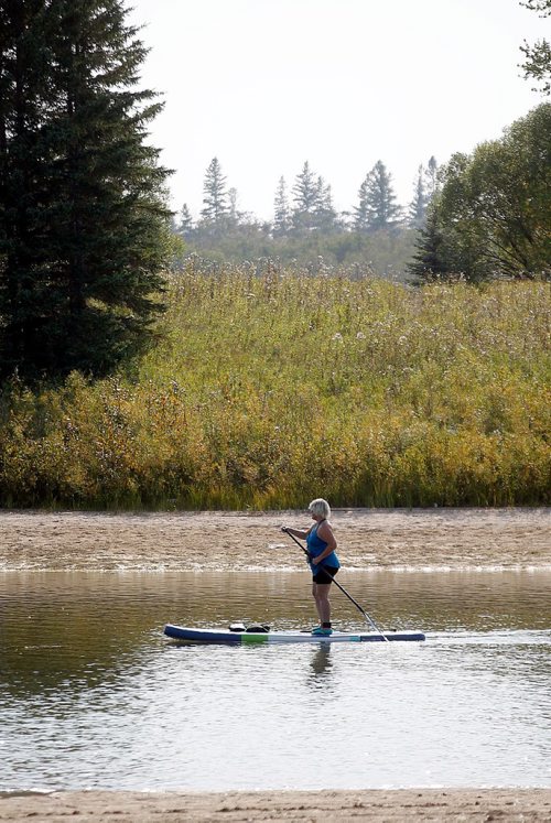 PHIL HOSSACK / WINNIPEG FREE PRESS  -  A paddle boarder makes the most of a 30C afternoon on the swimming lakes at Bird's Hill Provincial Park Tuesday afternoon.Temperatures soared and broke previous heat records for the day at 34.3C.....STAND-UP WEATHER...  - Sept 12, 2017