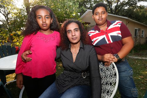 JOHN WOODS / WINNIPEG FREE PRESS
Saba Temnewo with her daughter Efrata (10) and son Asier (13), Eritrean refugees, are photographed at the Hospitality House residence Tuesday, September 12, 2017. Temnewo, whose English classes were cancelled, arrived as a refugee with her kids in July and needs to upgrade her English so she can go to school to become a health care aide and get a decent job to support her two kids. Without it, shell be stuck in a low-paying survival job or have to rely on assistance.