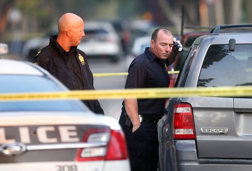 WAYNE GLOWACKI / WINNIPEG FREE PRESS
Winnipeg Police officers check out a vehicle on a section of Alfred Ave. near Salter St. taped off  Wednesday morning. Carol Sanders story  Sept. 13 2017