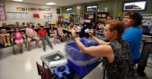 WAYNE GLOWACKI / WINNIPEG FREE PRESS

Green Page. At left, Mary Melnychuk with the Green Action Centre put on enthusiastic presentation on the importance of recycling to Debra Duncans class at École Varennes Wednesday. Here Mary and Debra,right, sort through the class room garbage container and recycle box to see if items were misplaced.     Dave Baxter story Sept. 13 2017