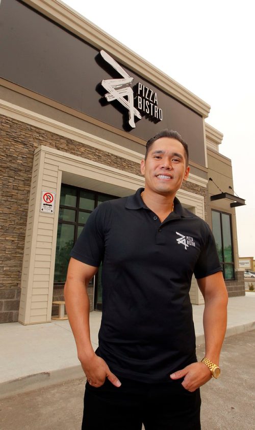 BORIS MINKEVICH / WINNIPEG FREE PRESS
Manly Cheung, president and CEO of the Winnipeg-based Za Pizza Bistro restaurant chain, in front of their new flagship Winnipeg location at 1573 Regent Ave. It is scheduled to open during the first week in October and is under construction at the moment. Sept. 13, 2017