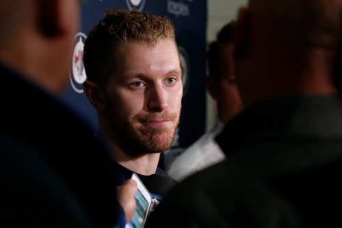 Winnipeg Jets' Bryan Little talks to media after signing a multi-year contract on opening day of the Jets' training camp Thursday, September 14, 2017 in Winnipeg. (The Canadian Press/John Woods)