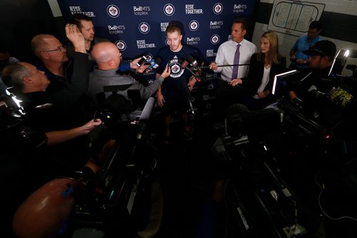 Winnipeg Jets' Bryan Little talks to media after signing a multi-year contract on opening day of the Jets' training camp Thursday, September 14, 2017 in Winnipeg. (The Canadian Press/John Woods)