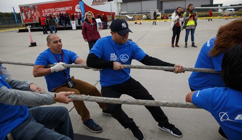 MIKE DEAL / WINNIPEG FREE PRESS
Over sixty teams from workplaces across Winnipeg test their might against a C-130 Hercules and Boeing 727 aircraft at the Red River College - Stevenson Campus in this years United Way fundraising Campaign's 14th annual Plane Pull.
170915 - Friday, September 15, 2017.
