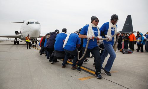 MIKE DEAL / WINNIPEG FREE PRESS
Over sixty teams from workplaces across Winnipeg test their might against a C-130 Hercules and Boeing 727 aircraft at the Red River College - Stevenson Campus in this years United Way fundraising Campaign's 14th annual Plane Pull.
170915 - Friday, September 15, 2017.