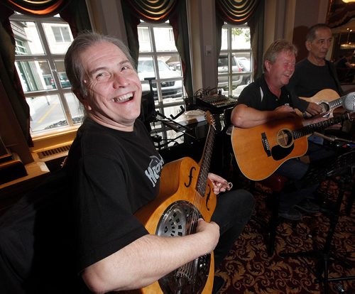 PHIL HOSSACK / WINNIPEG FREE PRESS - Left to right - Laurie MacKenzie Brad Derksen and Denis Petrowski warm up while setting up for a gig at the Fort Garry Hotel's Palm Room Friday. See Sanderson story.  - September 15, 2017