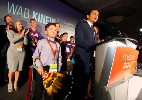 PHIL HOSSACK / WINNIPEG FREE PRESS  -  New leader of the Manitoba NDP gives his victory speech Saturday with his son  Bezh holding an eagle feather fan at his side. aKusch story. - Sept 16 2017